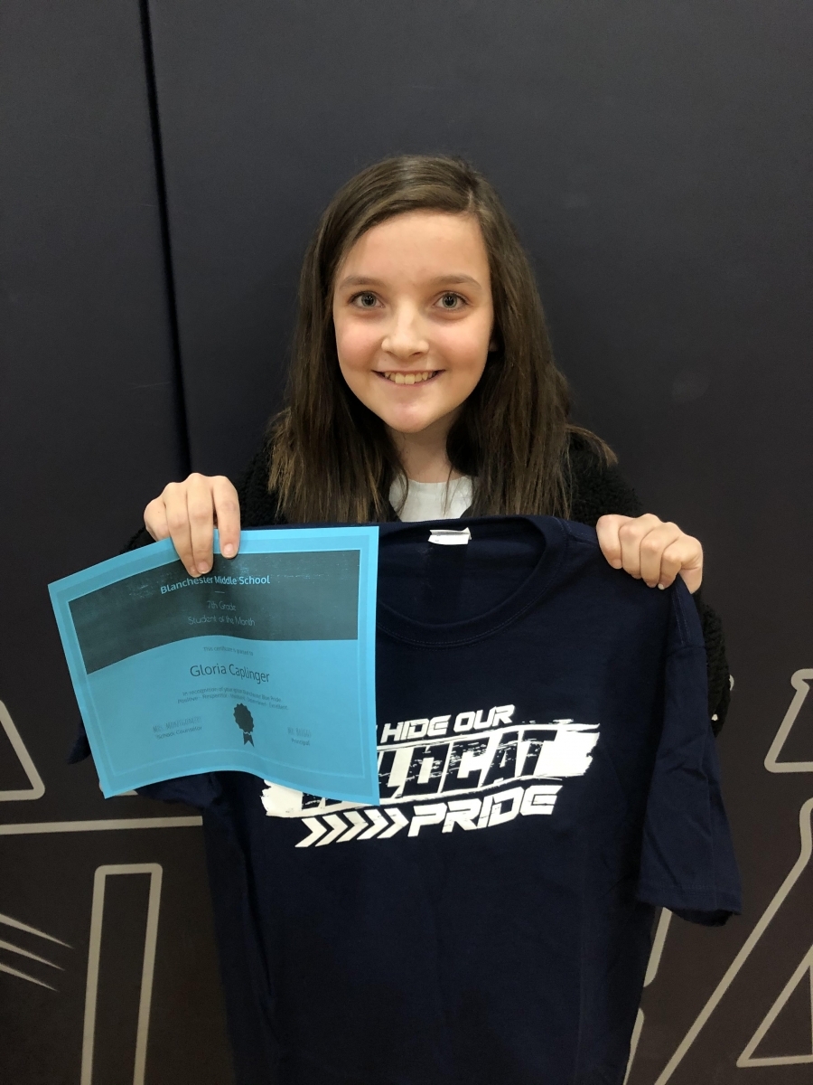 Gloria Caplinger with certificate and shirt